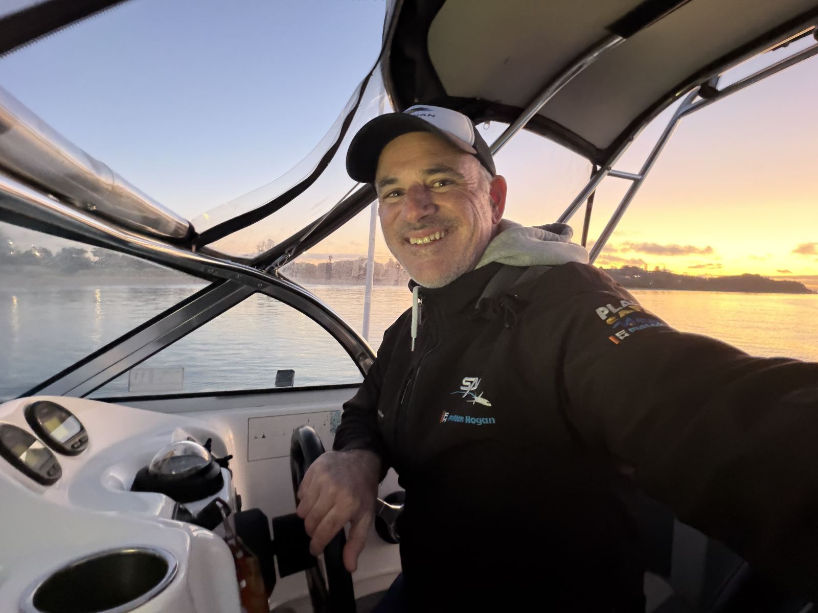 Matt Cini at the helm at sunrise