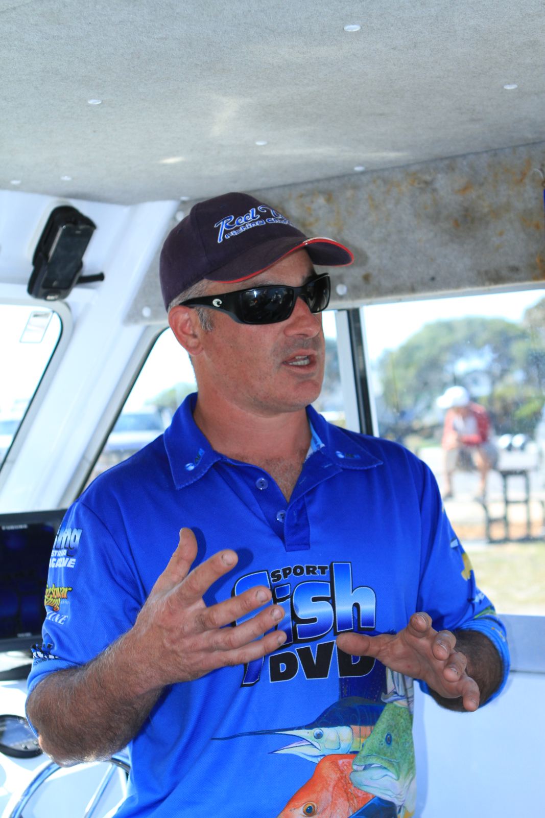 Matt Cini explaining fishing techniques on the boat
